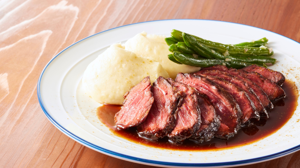 Fluffy Mashed Potatoes - How to Make Just Right 2 fluffy mashed potatoes with meat on a plate