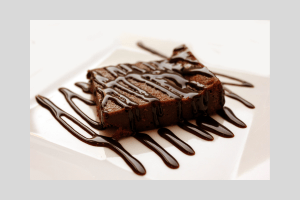 make boxed brownies better by drizzling chocolate sauce on top