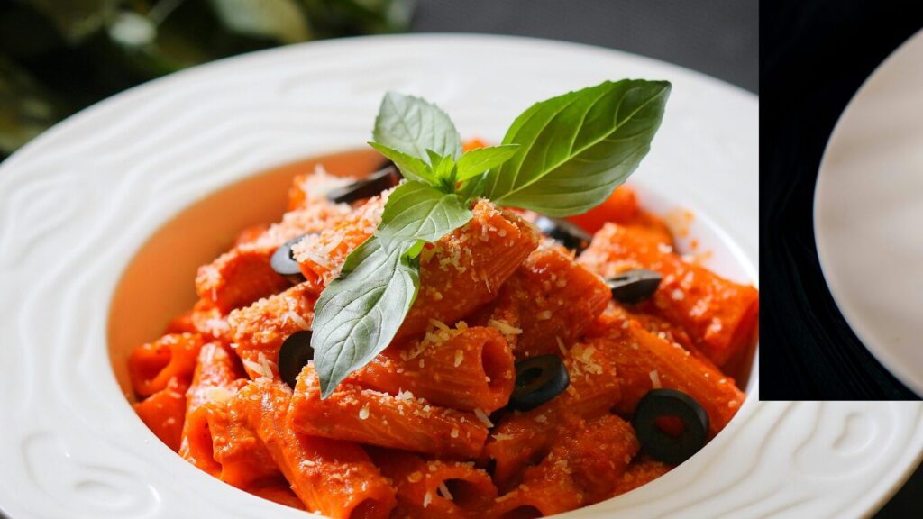 bowl of pasta cooking with basil