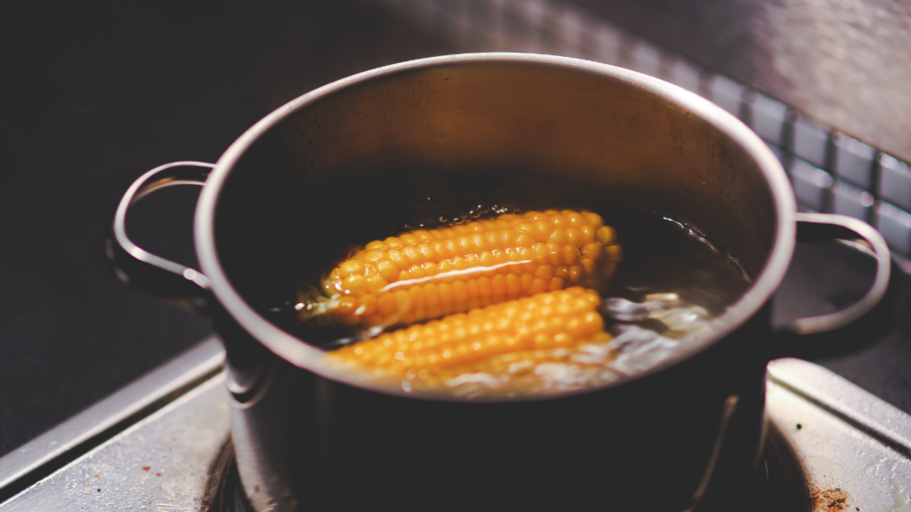 corn on the cob in pot of boiling water
